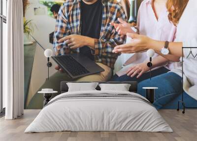 A group of business people using laptop computer while working together Wall mural