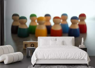 EQUALITY word on wooden blocks with diverse people in the background Wall mural