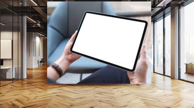 Mockup image of a woman holding digital tablet with blank white desktop screen in cafe Wall mural