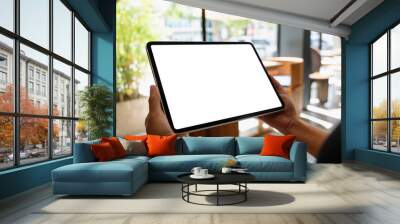 Mockup image of a woman holding digital tablet with blank white desktop screen Wall mural