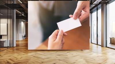 Two businessman holding and exchanging empty business card Wall mural