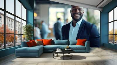 Portrait of a handsome smiling black businessman boss standing in his modern business company office. Wall mural