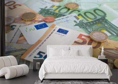 A pile of Euro money background. Euro cash banknotes and coins.  Wall mural