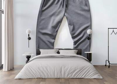 stunning  slim-fit grey men's sports pants, neatly displayed on a clean white background, highlighting the sleek and modern design Wall mural