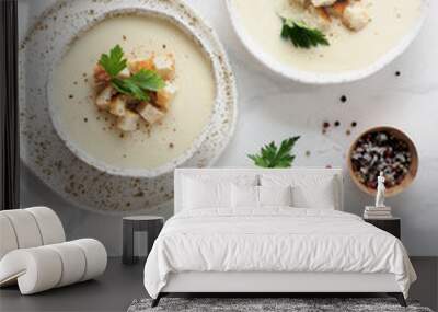 cauliflower potato soup puree on white marble tabletop, Creamy cauliflower soup with toasted bread croutons. Vegetarian healthy food concept. Ideas and recipes for winter meal. Top view or flat lay Wall mural