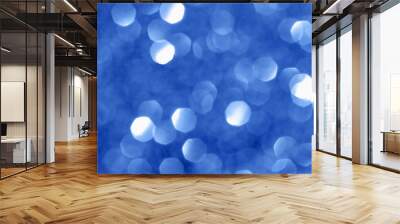 Sparkling background with bokeh made of blue color. Blurred backdrop for holidays and parties. Copy space for text Wall mural