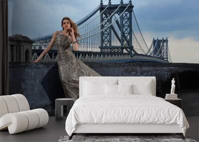 fashion model posing sexy on rooftop with bridge on background Wall mural