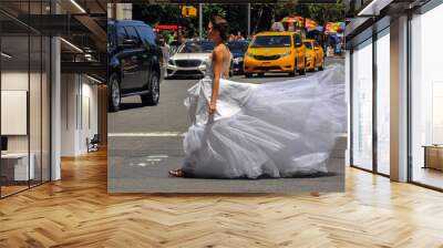 Model Kalyn Hemphill crossing the street in front of Plaza hotel at the Irina Shabayeva SS 2016 Bridal collection photo shoot. Wall mural