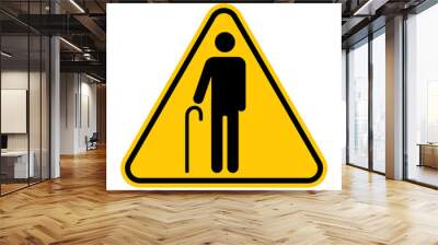 Elderly people warning sign. Vector illustration of yellow triangle sign with standing elderly man with cane icon inside. Priority access for old person. Wall mural