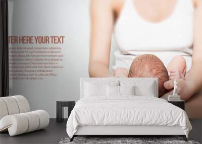 newborn baby in lap Wall mural