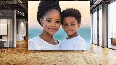 Beautiful black mom hugging son and smiling at the beach Wall mural