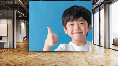 Happy Asian school boy giving thumbs up Wall mural