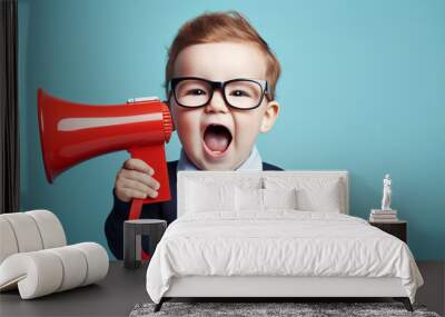 Happy baby boy holding a megaphone Wall mural