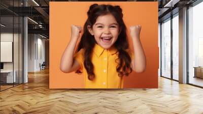 Happy school girl on a solid background Wall mural