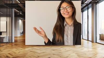 Create an image of a professional asian woman with long hair, wearing glasses, a blazer and a striped shirt. generative ai Wall mural