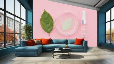 Petri dish with cosmetic product and leaf on pink background, flat lay.generative ai Wall mural