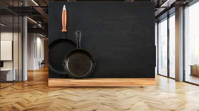 Kitchen utensils dark background with cast iron black kitchenware Wall mural