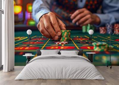 Close-up of player placing bet on roulette table in a casino. Wall mural