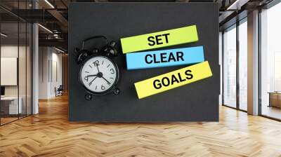 bell clock and colored paper with the words Set clear goals. a clear concept of goals and direction Wall mural