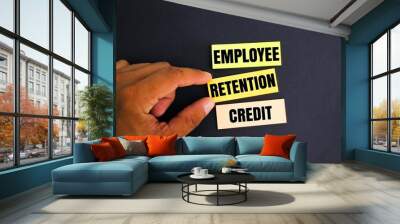 colored paper with the word Employee Retention Credit. the concept of employee salary retention Wall mural