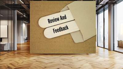 wood with the words review and feedback. important for fostering continuous improvement, motivation, and productivity in various areas of life and work Wall mural