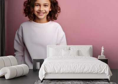 Teeage girl wearing a blank white sweatshirt standing in front of pink wall, studio photo of a girl for mockup, apparel with no print or label, 10 or 13 years old girl Wall mural