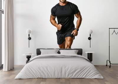 30s runner man, wearing black t-shirt and shorts, isolated on white Wall mural