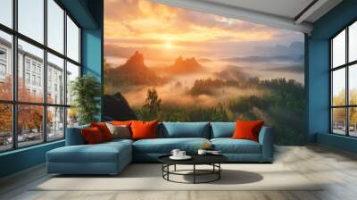 hazy panorama of the landscape. Wonderfully surreal dawn on rugged peaks, offering a glimpse of the foggy valley beneath. cloud cover above the forest. A view of the fanciful countryside below.  Wall mural