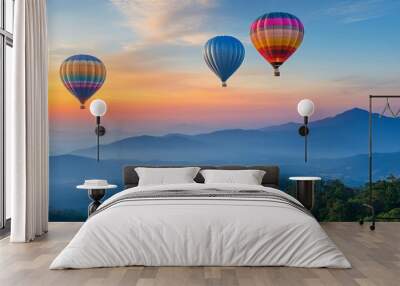 Overlooking a peak at Dot Inthanon in Chiang Mai, Thailand, are colorful hot air balloon flights. Wall mural