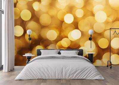 Golden bokeh lights on a blurred background for creative design. Wall mural