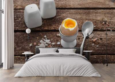 Soft boiled egg on wwoden background, rustic style, copy space Wall mural