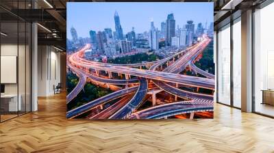 aerial view of a highway overpass at night in shanghai - china. Wall mural