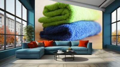 Close view of two towels on a wooden table Wall mural