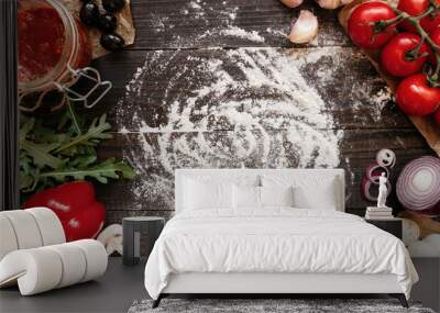 Cooking Pizza. Pizza ingerdients on the wooden table with copy space, top view Wall mural