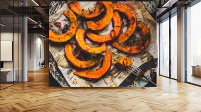 Delicious baked pumpkin with thyme and chilli on the wooden table, top view Wall mural