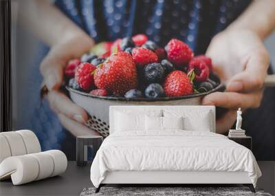 organic fresh berries. hands holding fresh juicy berries, closeup Wall mural