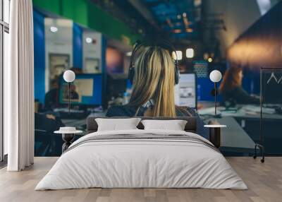 A journalist working on a computer in Newsroom Wall mural