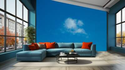 Puffy Clouds on a Blue Evening Sky Wall mural