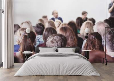 audience in small classroom. adult students listen to professor. group of professionals in audience  Wall mural