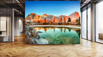 Mountain lake Limides in Italy, located in south Tyrol in high Dolomite Alpine mountains. Blue, red and turquoise colors in nature. Gorgeous landscape photography, panoramic view. Sunrise scenery. Wall mural