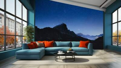 Night sky with stars in Dolomites Alps in Italy. View on Tofana di Rozes mountain ridge. Wall mural