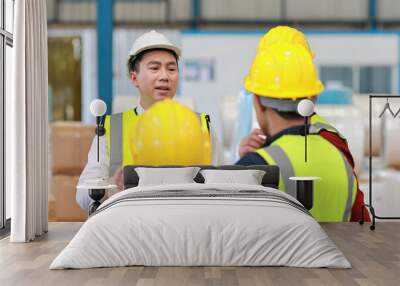 Group of technician engineer and businessman in protective uniform standing and discussing, researching, brainstorming and planning work together with protection mask at industry manufacturing factory Wall mural