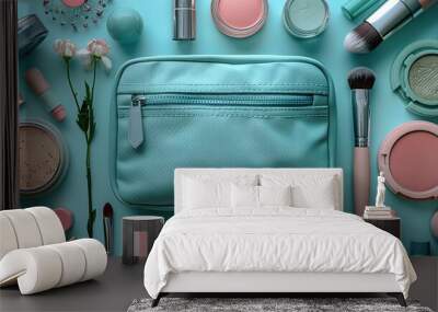 Flat lay of a cosmetic bag and luxury makeup products on a blue background. Wall mural