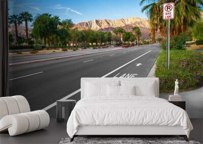 Bike lane on suburban street with road sign Wall mural