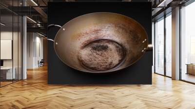 Used and seasoned wok with black background Wall mural