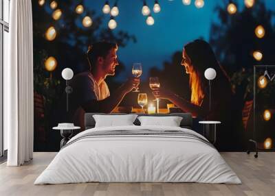 A couple enjoys a romantic dinner under the stars, toasting with glasses of wine. Wall mural