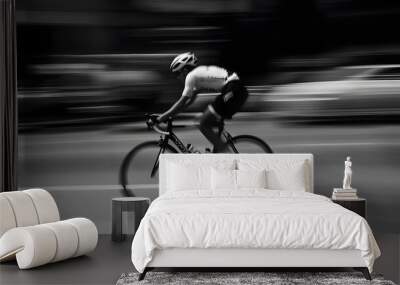 A cyclist speeds down a city street, blurred motion creating a sense of speed. Wall mural