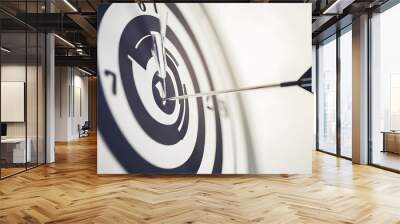 A dart hits the bullseye of a dartboard. Wall mural