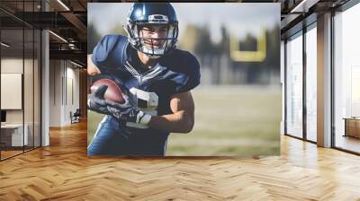 Football player in blue uniform runs with ball. Wall mural