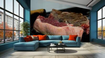 two sirloin steaks being grilled on iron cast Wall mural